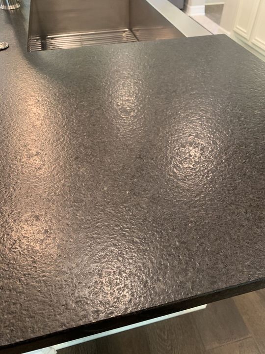 Close-up of a leathered black granite countertop