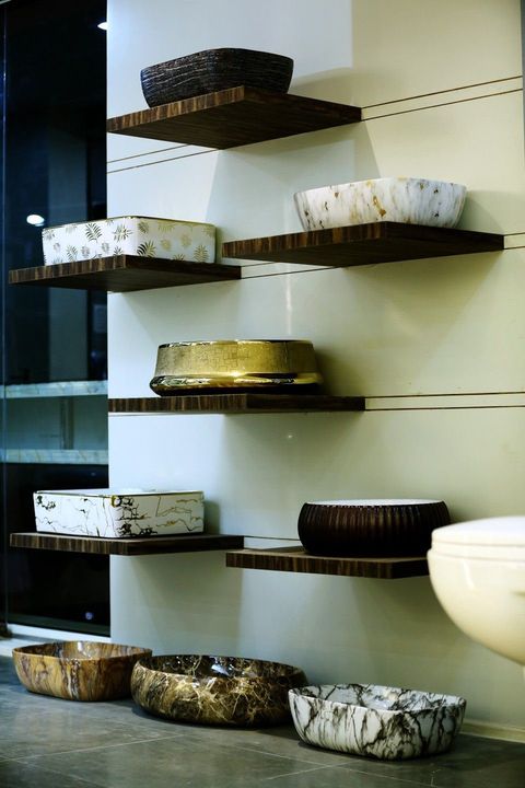 Designer vessel basins on floating wooden shelves